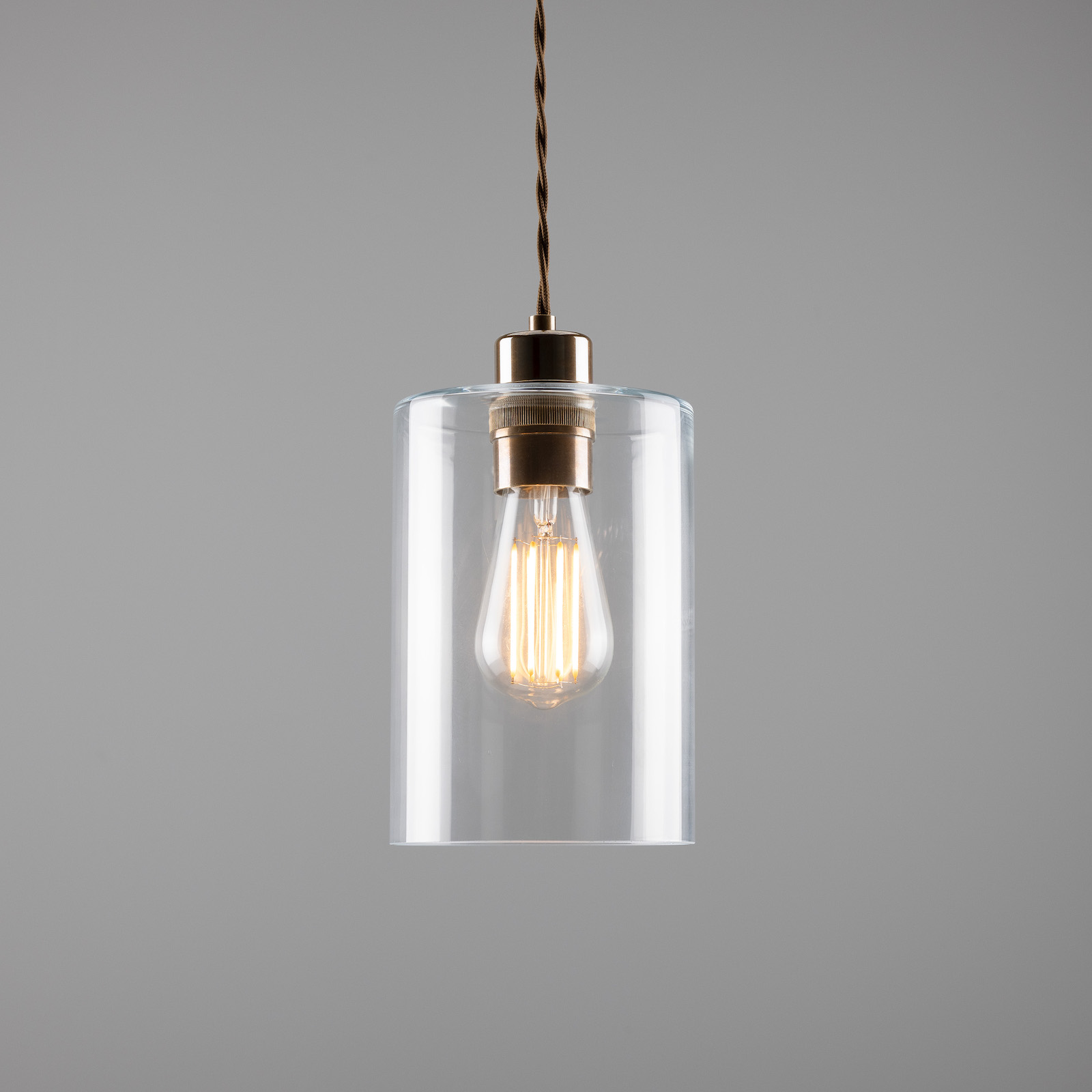 Small pendant lamp with clear glass cylinder: Alt-Messing patiniert