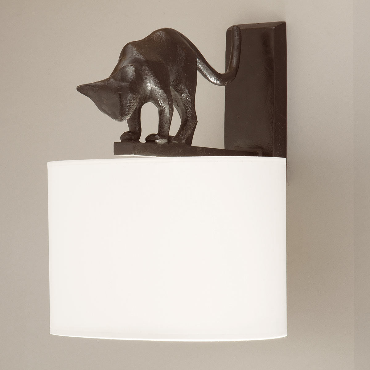 Bronze cast wall light LILI with cat sculpture and fabric shade