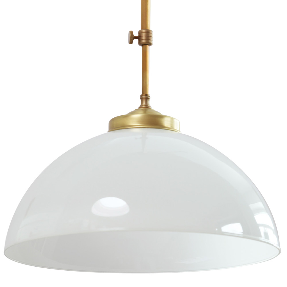 Classic brass dining table ceiling light with glass hemisphere