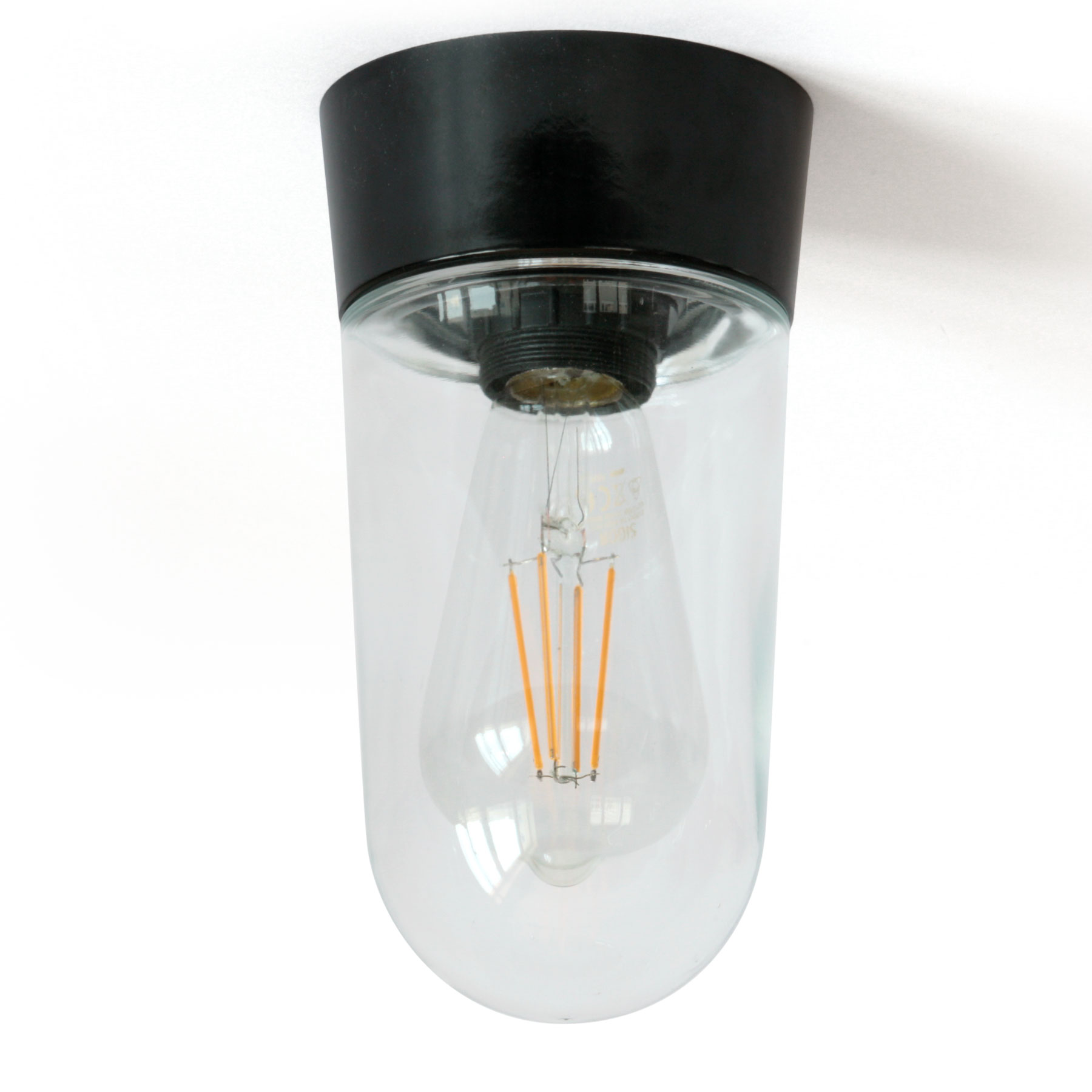 Einfache Deckenleuchte mit Bakelit-Sockel und klarem Zylinder-Glas – Casa Lumi