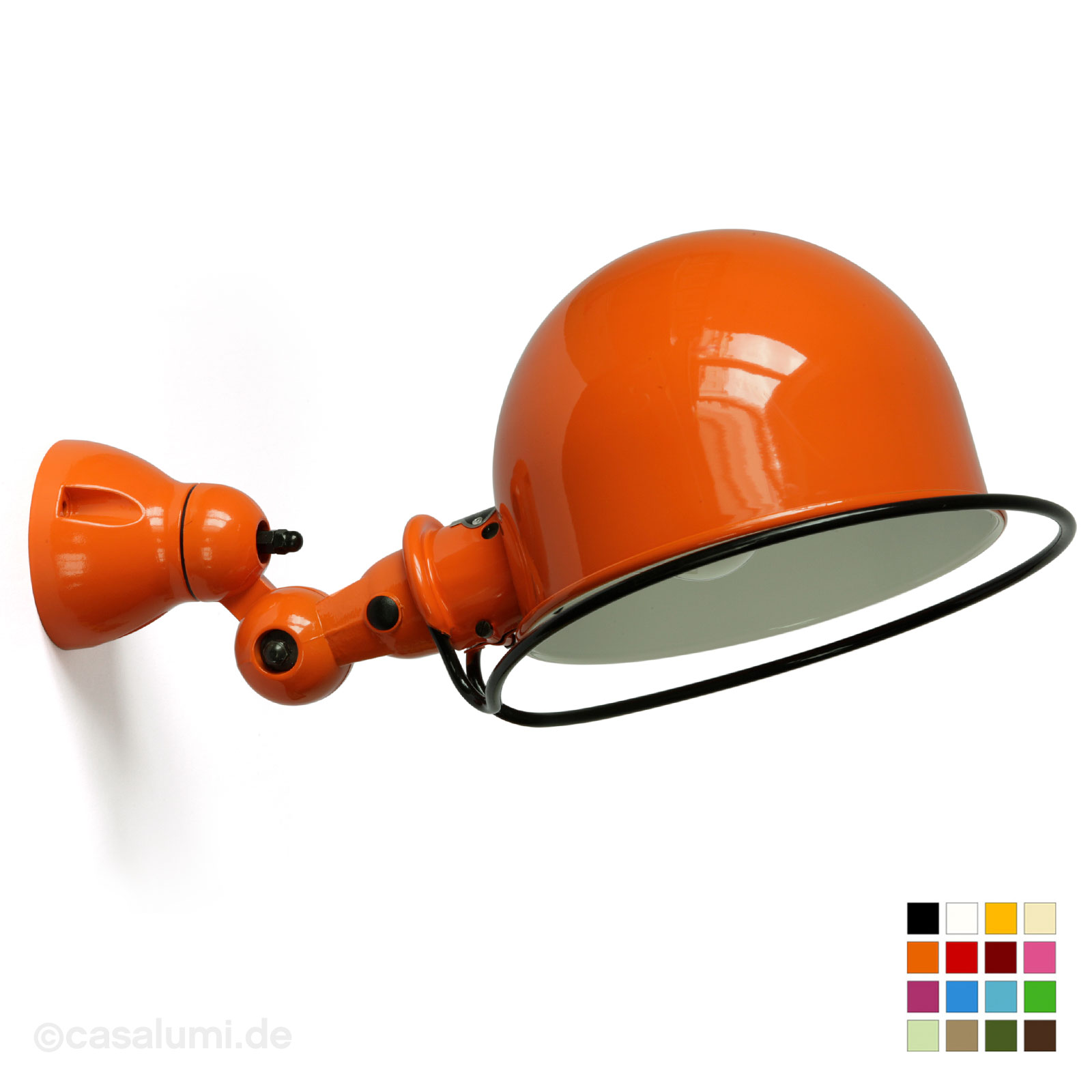 Fig. 1: D1020 by Jieldé: Jointed wall lamp with 20 cm shade, shown in orange (RAL 2004). Jointed wall lamp Jieldé D1020 with large hemisphere shade Ø 20 cm: D1020 by Jieldé: Jointed wall lamp with 20 cm shade, shown in orange (RAL 2004).